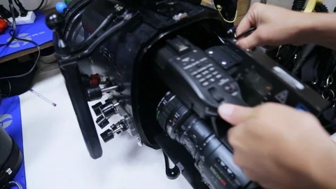 Diver sliding camera into underwater housing before filming Stock Footage 87366847