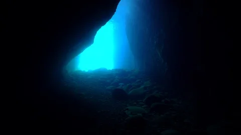 Diver swimming in the cave Stock Footage 127942162