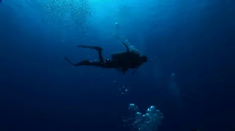 Diver Swimming at Surface with Bubbles. Stock Footage 10922055