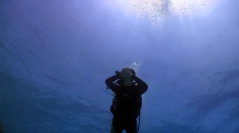 Diver swims over camera. Red sea Stock Footage