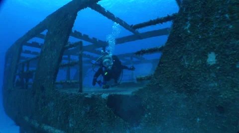 Diver Swims in Wreck Stock Footage 36374689