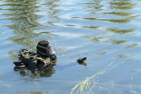 Diver with underwater camera Photos
