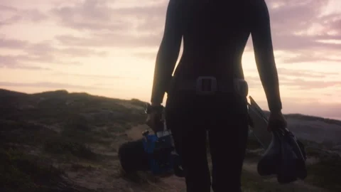 Diver walking towards the beach Stock Footage 279425068