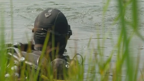 A diver in the water. A diver inspects the bottom. scuba diver. scuba diver in 動画素材 112786855