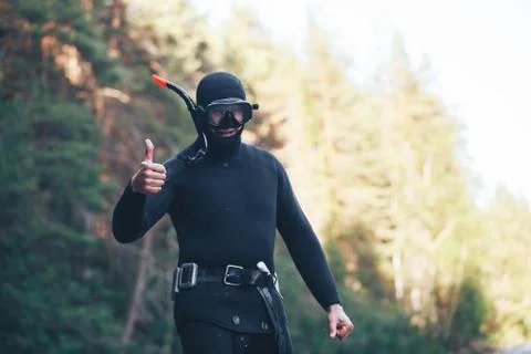 Diver in Wetsuit with Thumbs Up Gesture Stock Photos