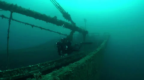 Divers and the sunken wreck Stock Footage 36558308