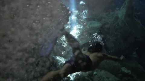 Divers in cave Stock Footage 82632273