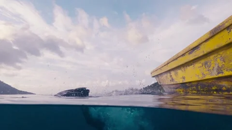 Divers doing backward roll entry off a boat Stock Footage 266203593