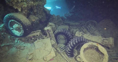 Divers explore the wreck of the SS Thistlegorm. Top diving wreck dives Stock Footage 284658290
