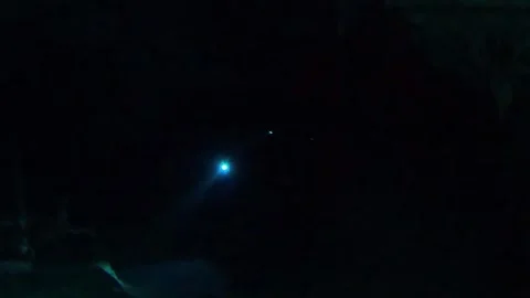 Divers exploring a dark underwater sea cave in Tulum Mexico 스톡 동영상 331113823