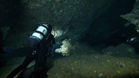 Divers go down the crevices between the rocks, Ustica, Mediterranean sea Stock Footage 126902098