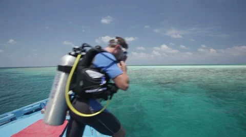 Divers jumping in water Stock Footage 10788240