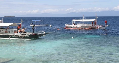 Divers on Outrigger 1 Stock Footage 125127975