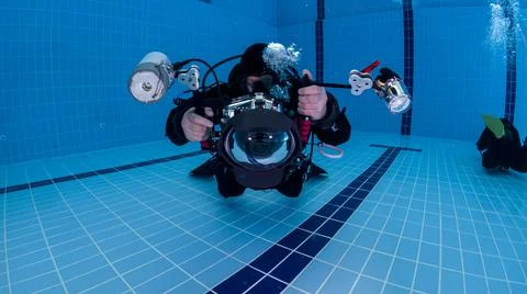 Divers practice practical exercises in the pool Stock Photos