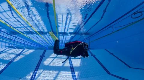 Divers practice practical exercises in the pool Stock Photos