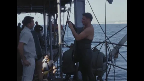 Divers prepare to jump in the sea - 1965 Stock Footage 103202339
