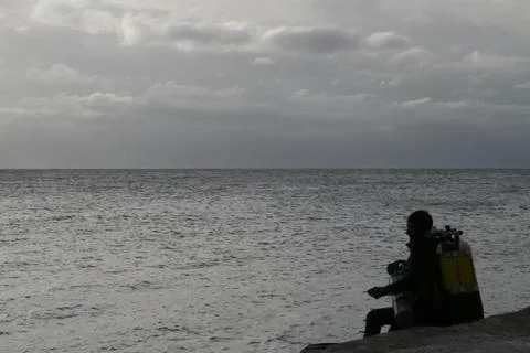 Divers preparing to jump into the sea Stock Photos