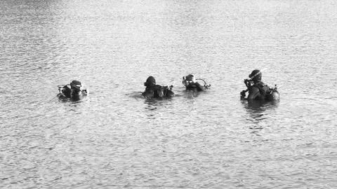 Divers ready for descent BW Stock Photos