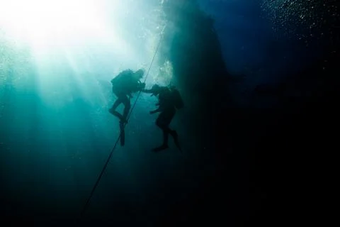 Divers returns to the surface Stock Photos