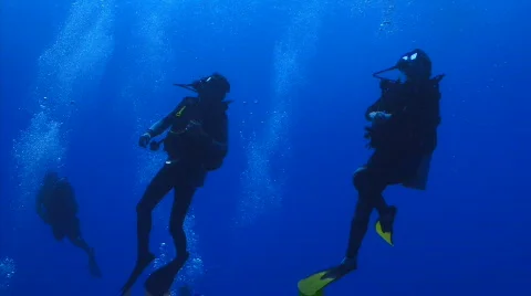 Divers silhouette on wall SR from below Stock Footage 721148