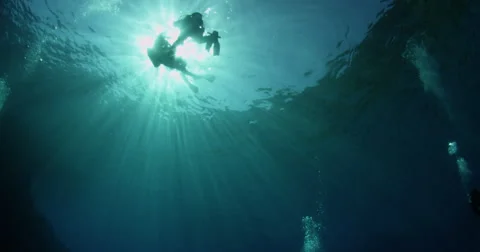 Divers in a sunball Stock Footage 56839425