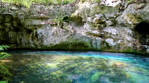 Divers swim cave Dream Gate Cenote near Dos Ojos, Mexico. Stock Footage 90548892