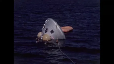 Divers towing Apollo 8 back-up crew command module water egress training Video stock 271518423