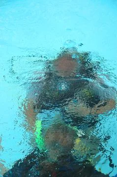 Divers under the water Stock Photos