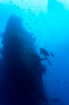 Divers on wreck Stock Photos