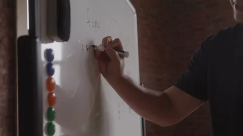Diverse 20 Something Math Teacher Writes Out Problem on Classroom Whiteboard Stock Footage 208795985