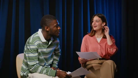 Diverse Actors Rehearsing Script for Theater Performance Stock-Footage 344524110