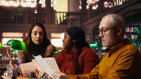 Diverse actors team reading their scripts during theatre drama play rehearsal Stock Footage 313310903