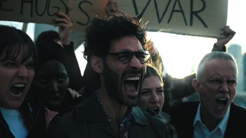 Diverse ages group of activists gathered shouting at demonstration. People Stock Footage 263145200