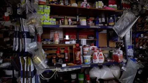 Diverse Array of Tools and Equipment on Shelves in Busy Hardware Store Video stock 331051730