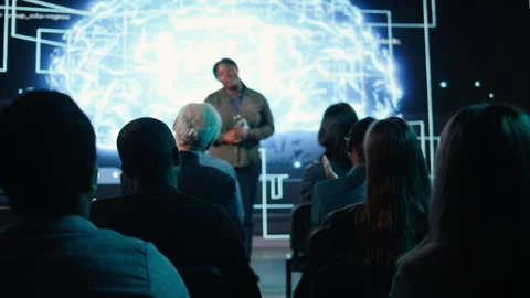 Diverse audience clapping hands and listening to AI presentation Stock Footage 328263440