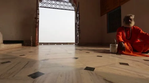 Diverse Authentic Indian priest doing meditation inside temple Stock Footage 55547622