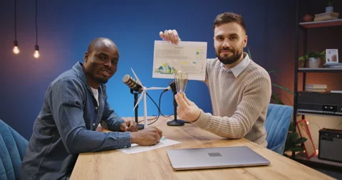Diverse broadcasters discussing ecology and sustainable energy, hosting podcast Stock Footage 328973360