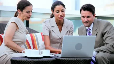 Diverse business colleagues planning funds on laptop computer Stock Footage