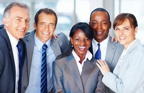 Diverse business group smiling together. Closeup portrait of diverse business Stock Photos