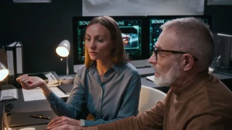 Diverse Car Designers Suggesting Modifications to Digital Render on Computer Stock Footage 304425644