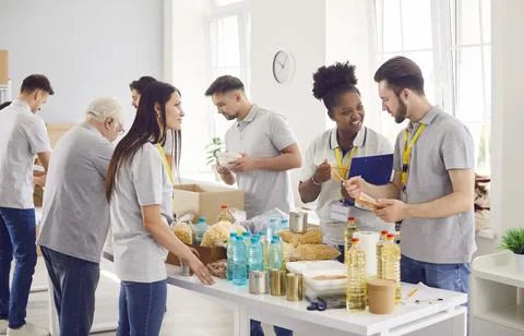 Diverse caring volunteer group working in charitable food foundation, make Stock Photos