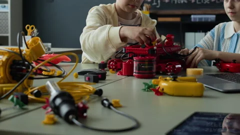 Diverse Children Assembling Robots in Stem Classroom Stock Footage 339198098