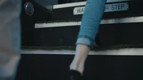 Diverse children legs boarding schoolbus closeup. Pupils going upstairs vehicle 스톡 동영상 197000570