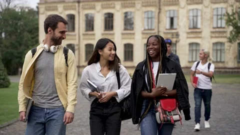 Diverse classmates chatting while walking outdoors Stock-Footage 163282757