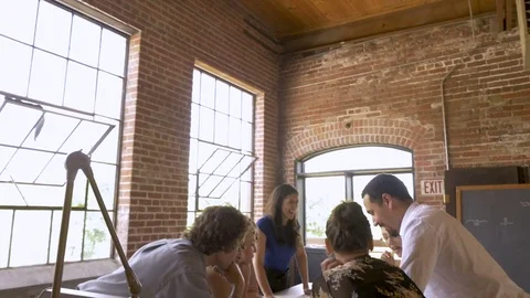 Diverse collaborative startup team brainstorming during a business meeting Видео 78915812