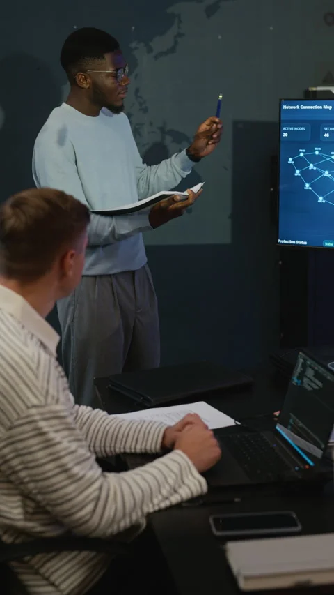 Diverse Colleagues Analyzing Network Data in Cybersecurity Office 스톡 동영상 346817102