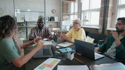 Diverse Colleagues and Man in Wheelchair Having Business Meeting Stock Footage