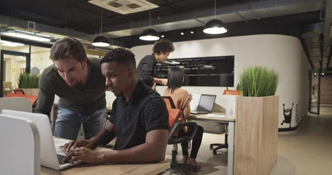 Diverse colleagues collaborating in office Stock Footage 195221481