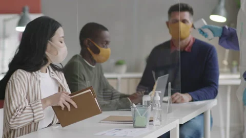 Diverse Colleagues Getting Body Temperature Checked Video stock 144101009