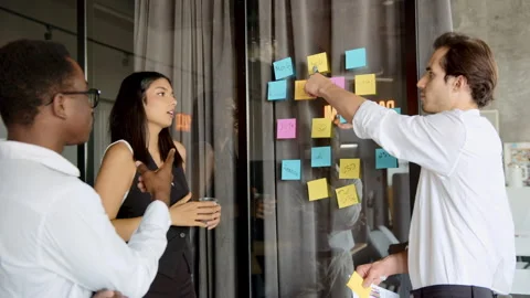 Diverse colleagues from a professional team actively brainstorming new ideas Stock Footage 335745494